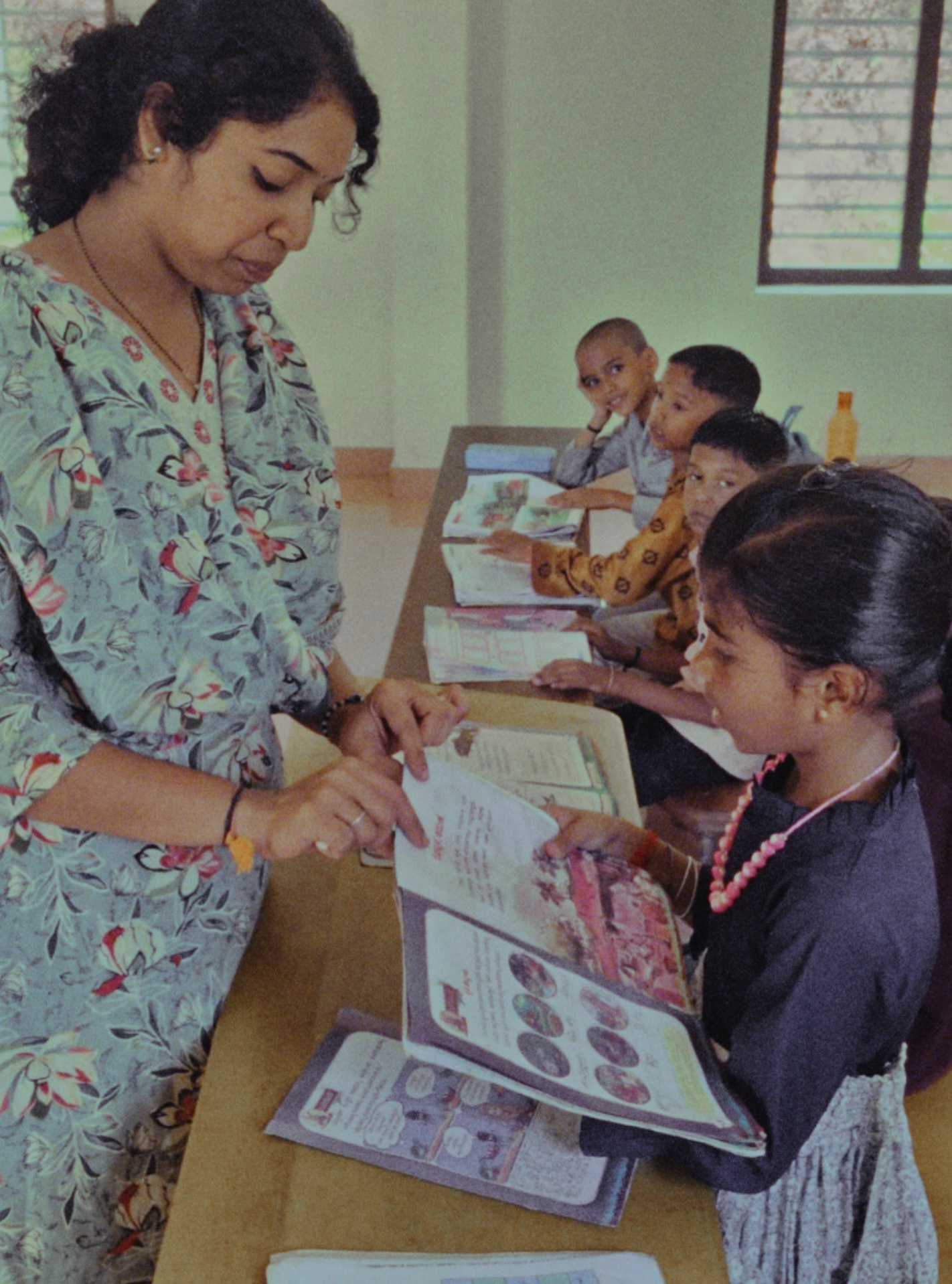 Teacher leading a classroom lesson at AUPS Pallathadka