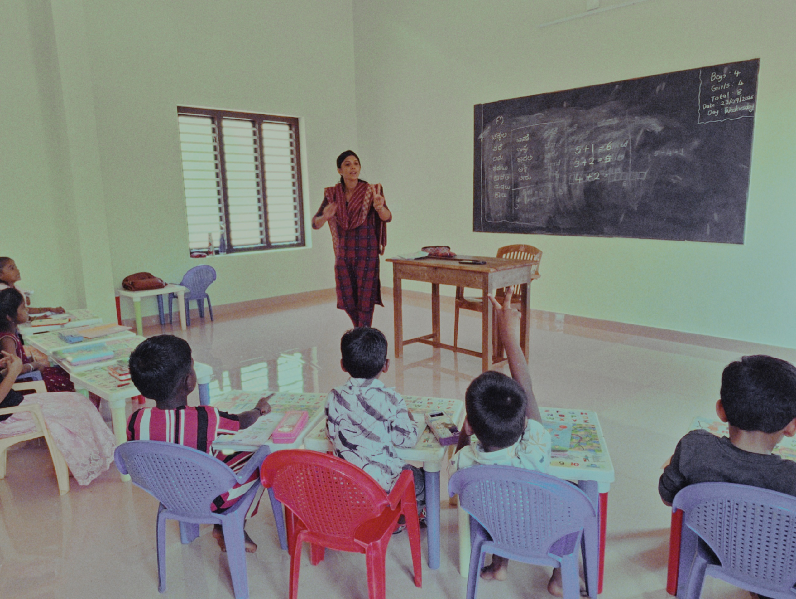 Teacher leading a classroom lesson at AUPS Pallathadka